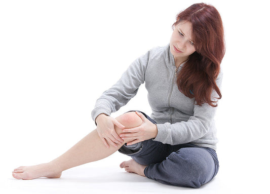 Person experiencing widespread pain and fatigue, common symptoms of fibromyalgia.